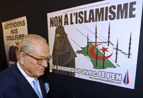 France's far-right National Front political party leader Jean-Marie Le Pen arrives for a news conference before a political rally for the upcoming regional elections in Marseille March 7, 2010. The placard reads "No to Islam." REUTERS/Jean-Paul Pelissier (FRANCE - Tags: POLITICS RELIGION ELECTIONS)