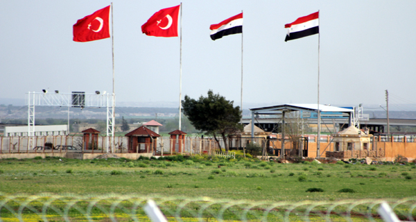 This Tuesday, April 10, 2012, photo shows the border crossing between Turkey and Syria from a refugee camp near the border, in Kilis , Turkey. Turkey's prime minister accused Syria of infringing its border and said Tuesday that his country is considering what steps to take in response. (AP Photo/Germano Assad)