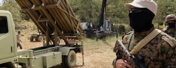 Hezbollah fighters and weapons in Aramta 2023 (AFP)