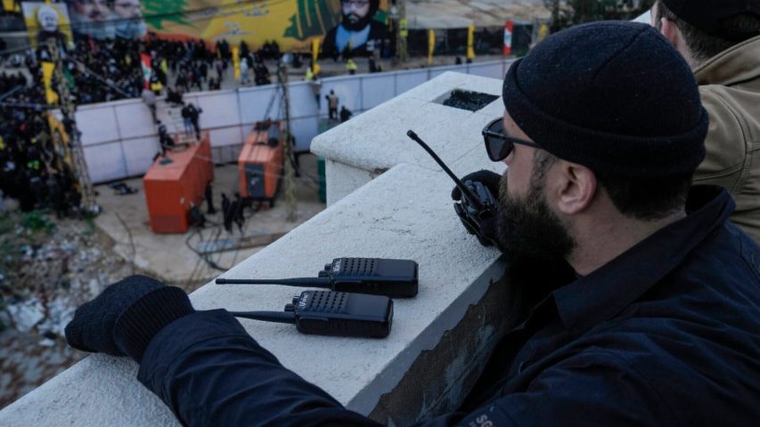 Hezbollah member speaks on walkie-talkie (AP)