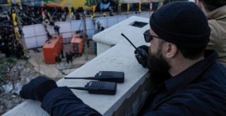 Hezbollah member speaks on walkie-talkie (AP)